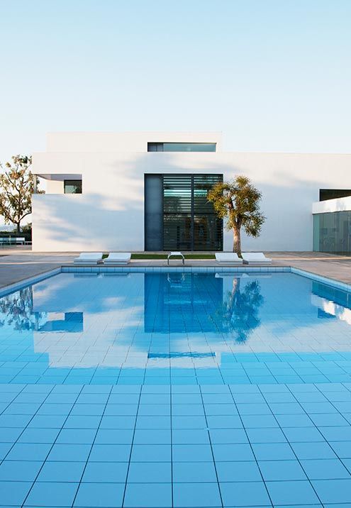 Finished modern pool with a clean blue finish and still water