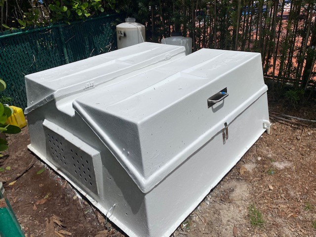 Closed refurbished Vak-Pak fiberglass equipment vault with fitted covers